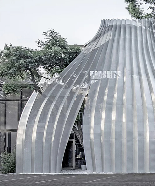 archstudio applies a translucent metal curtain to clad IOMA art center in beijing
