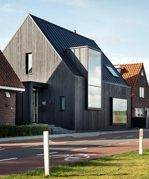 blackened timber clads arjen reas architects' dyke house in the netherlands