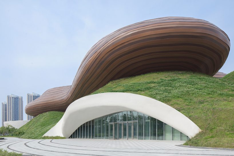 organic lines and undulating greenery form CROX's liyang museum in china designboom