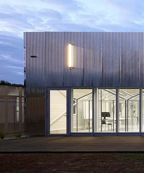 freaks wraps a double skin of corrugated stainless steel around office building in france