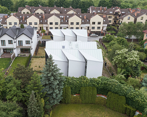 superhelix studio layers and overlaps light-filled housing units with its 'house with gills'