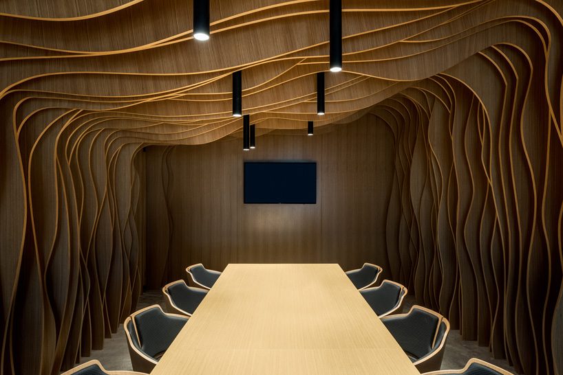 MMA projects uses cement + black glass for sculptural 'axiom telecom' headquarters in dubai