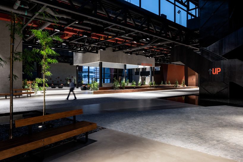 MMA projects uses cement + black glass for sculptural 'axiom telecom' headquarters in dubai