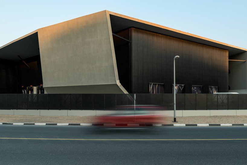  MMA projects uses cement + black glass for sculptural 'axiom telecom' headquarters in dubai