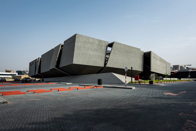  MMA projects uses cement + black glass for sculptural 'axiom telecom' headquarters in dubai