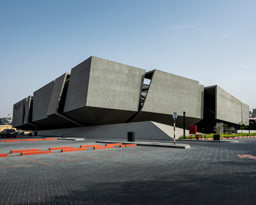 MMA projects uses cement + black glass for sculptural 'axiom telecom' headquarters in dubai