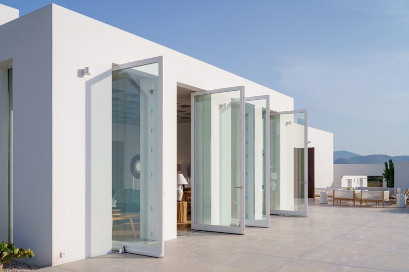 react architects steps ‘the gaze’ house into idyllic greek island landscape