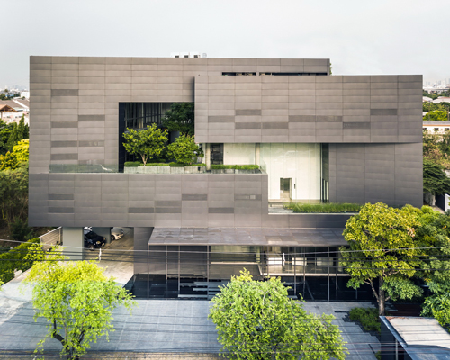Stu/D/O combines interlocking masses + green pockets in the macrocare office in bangkok