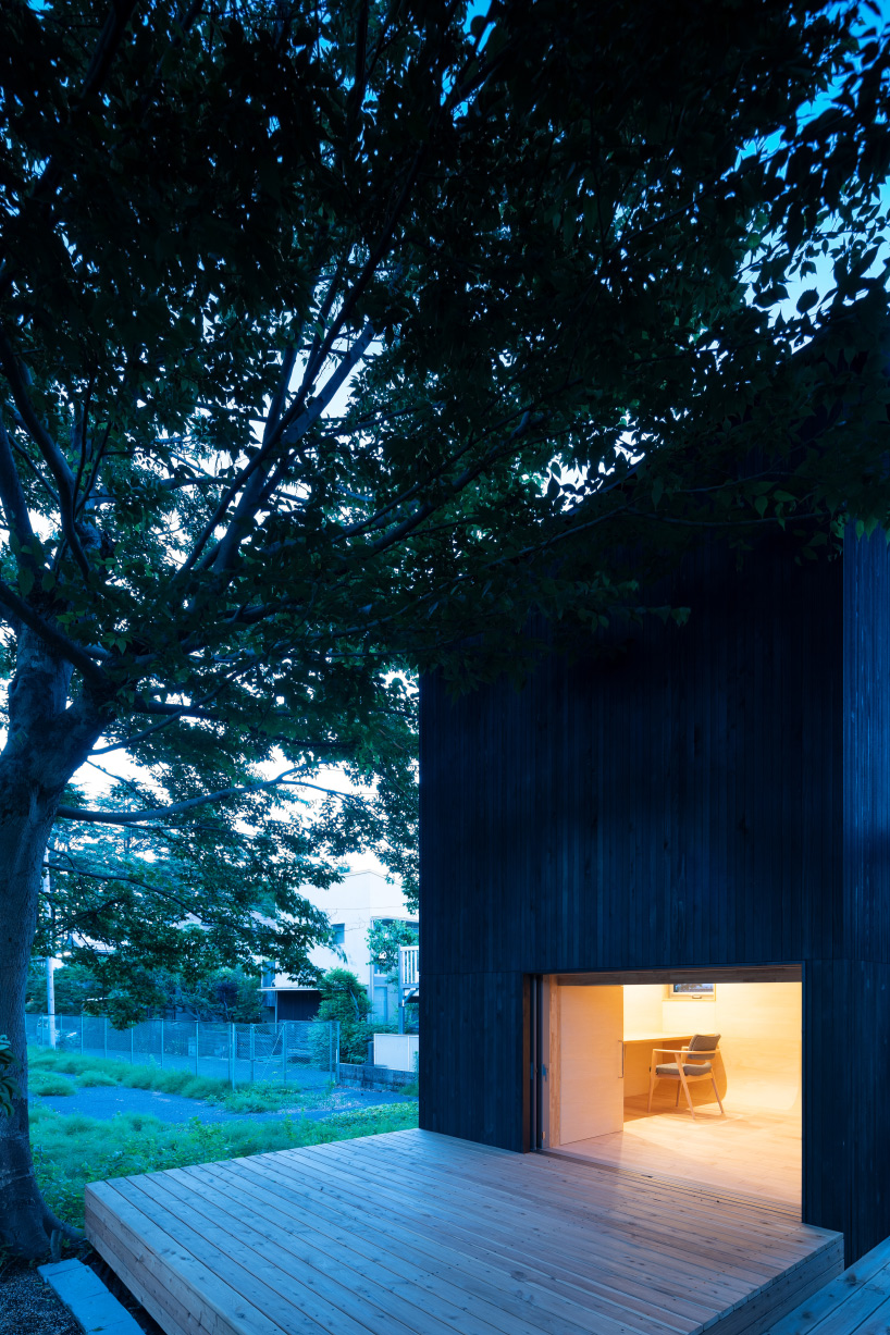 tunnel by takehiko suzuki architects is a small hut in tokyo clad in charred japanese cedar