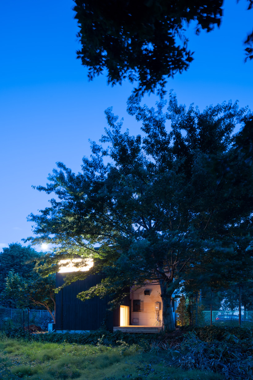 tunnel by takehiko suzuki architects is a small hut in tokyo clad in charred japanese cedar