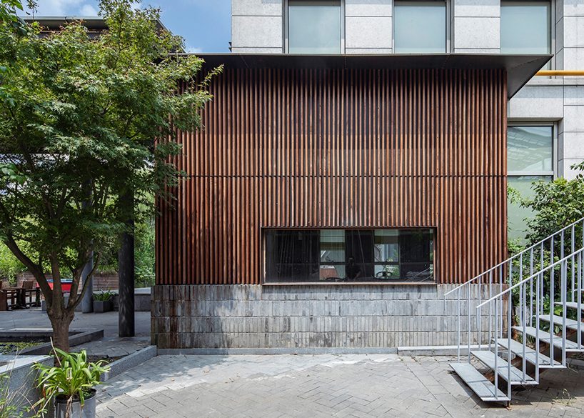 TEMP combines timber and granite to design ajia teahouse in china