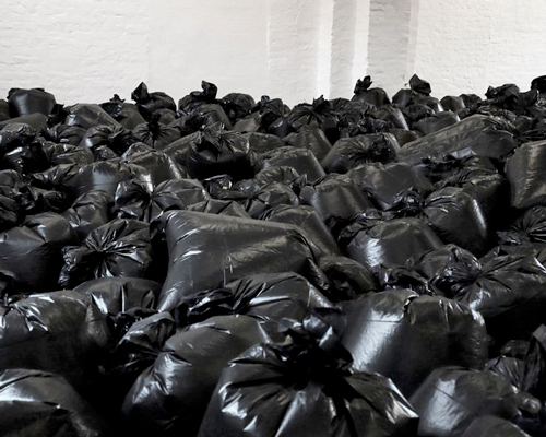 the krank installs 500 plastic trash bags in berlin to highlight our consumerist society