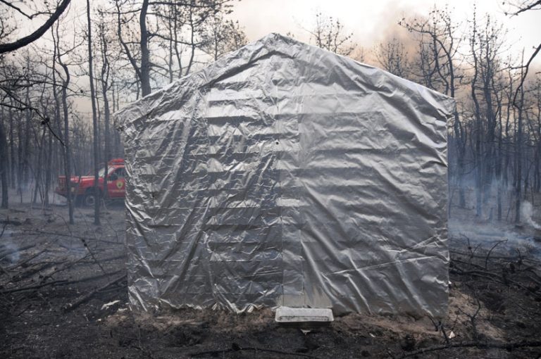 engineers created a huge foil blanket that protects homes from forest fires
