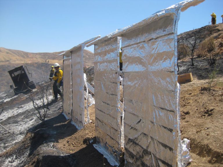 engineers created a huge foil blanket that protects homes from forest fires