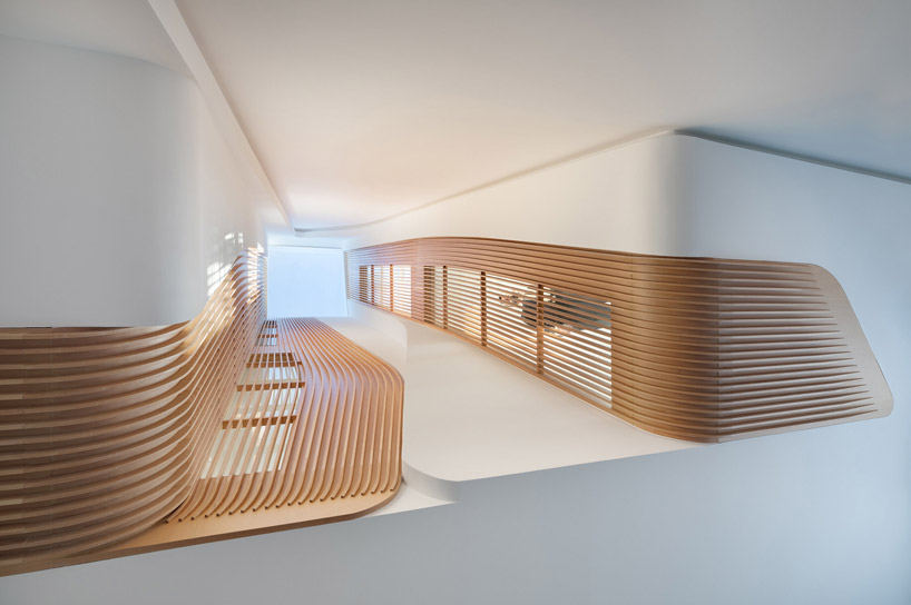 FLOW architecture renovates victorian apartment in london with sculpted wooden interiors
