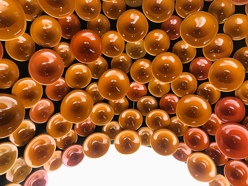 metamorphosis: andrea mancuso creates cavernous, ceramic-clad installation for perrier-jouët