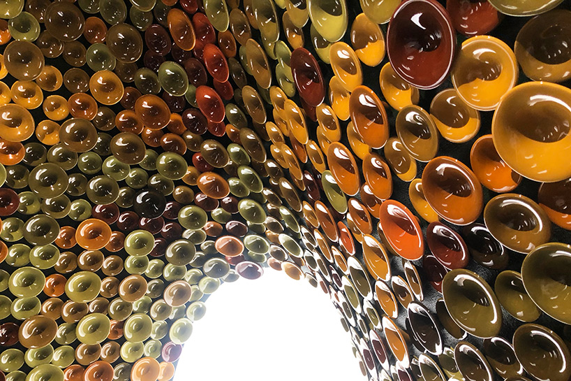 metamorphosis: andrea mancuso creates cavernous, ceramic-clad installation for perrier-jouët