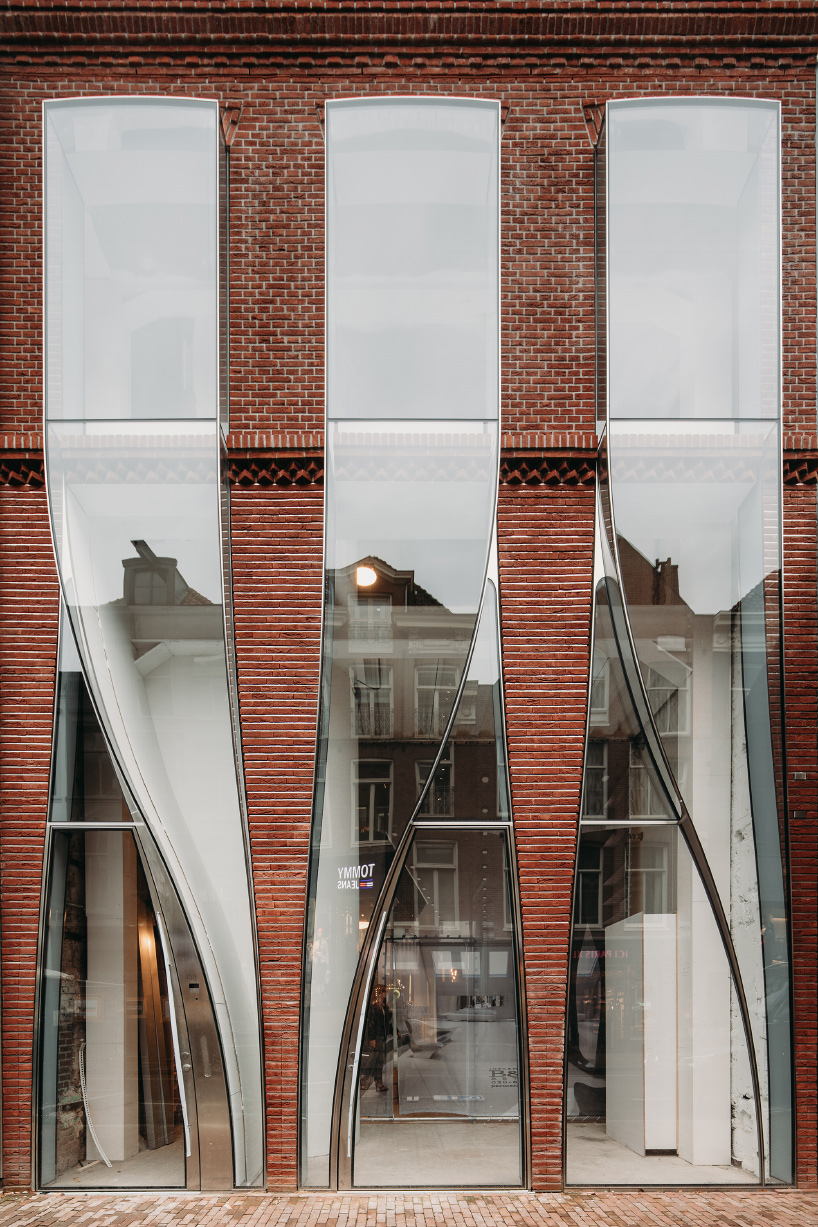 UNStudio’s ‘looking glass’ façade in amsterdam mimics billowing fabric