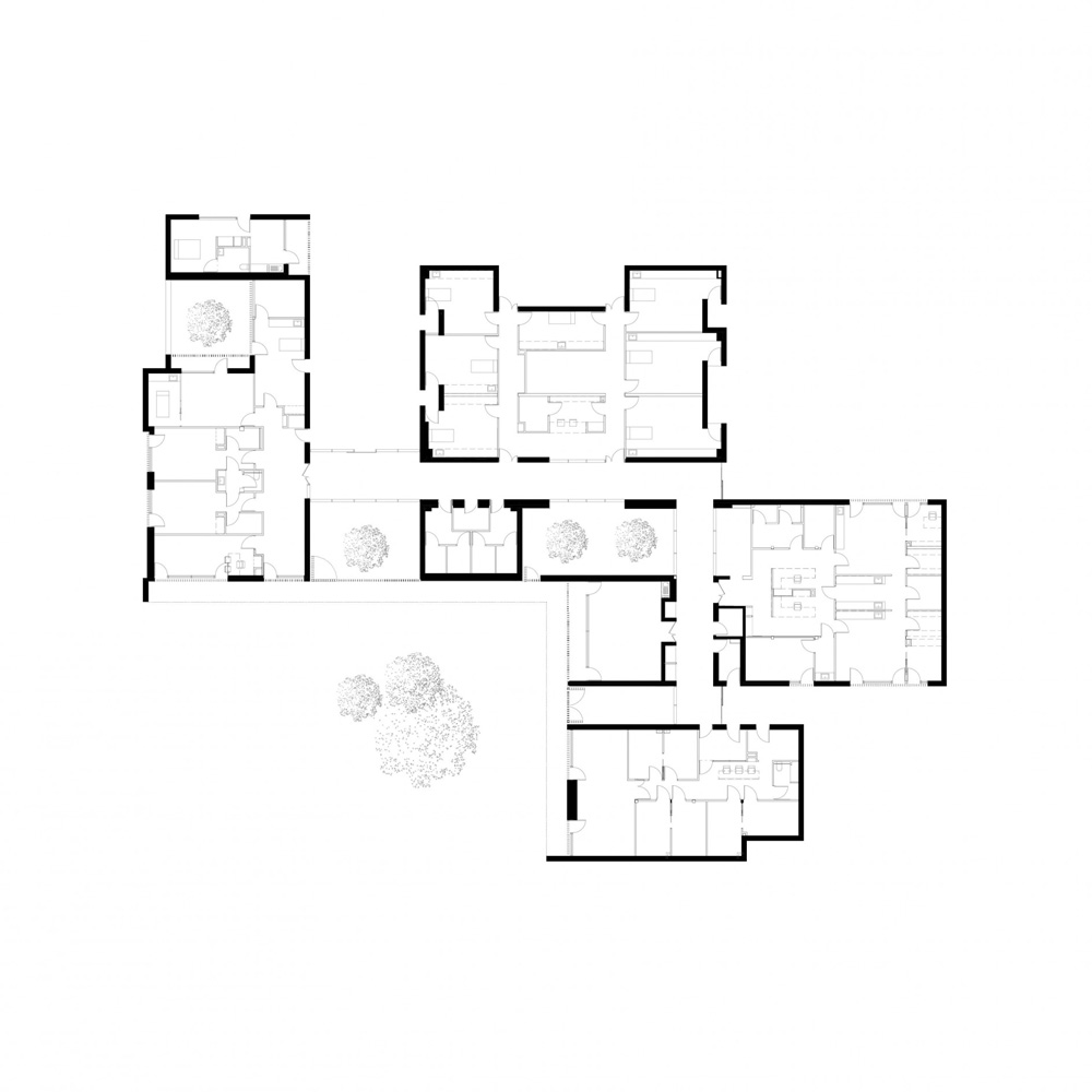 A6A combines white concrete + charred wood for les patios health center in france