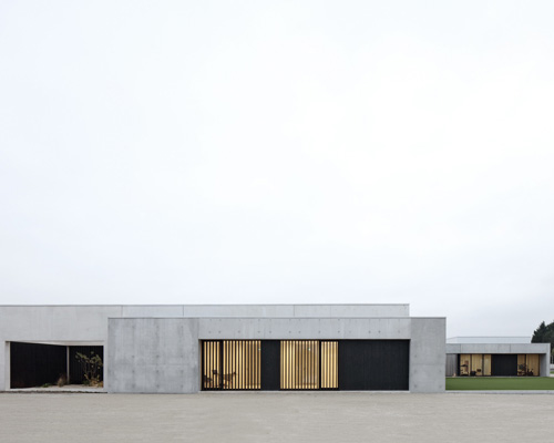 A6A combines white concrete + charred wood for les patios health center in france
