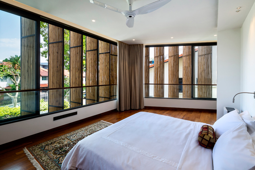wallflower wraps house in singapore in a bamboo veil of operable screens