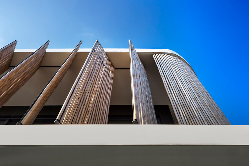 wallflower wraps house in singapore in a bamboo veil of operable screens