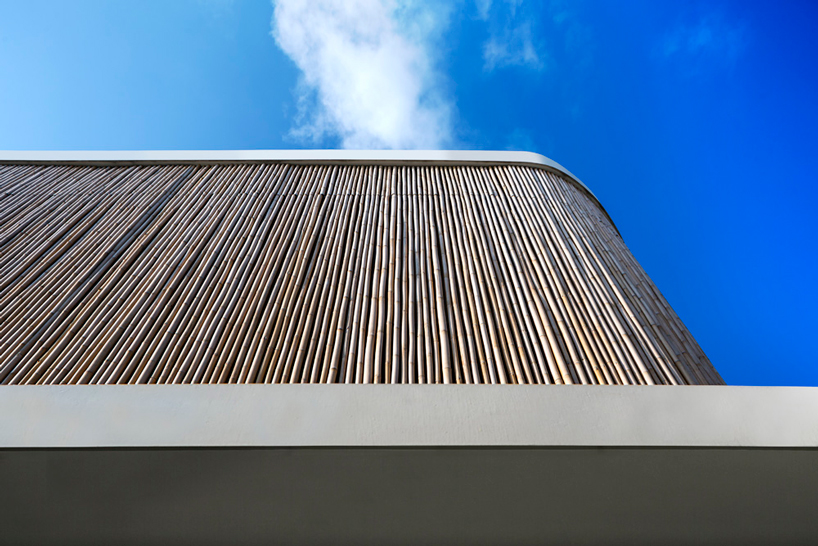 wallflower wraps house in singapore in a bamboo veil of operable screens