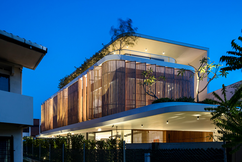 wallflower wraps house in singapore in a bamboo veil of operable screens