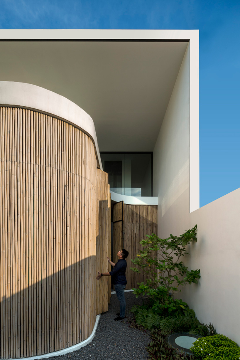  wallflower wraps house in singapore in a bamboo veil of operable screens