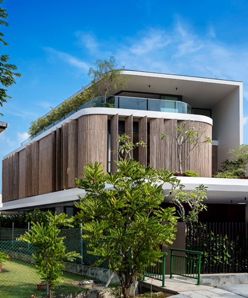 wallflower wraps house in singapore in a bamboo veil of operable screens