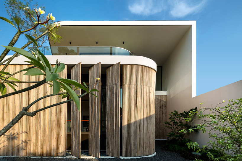  wallflower wraps house in singapore in a bamboo veil of operable screens
