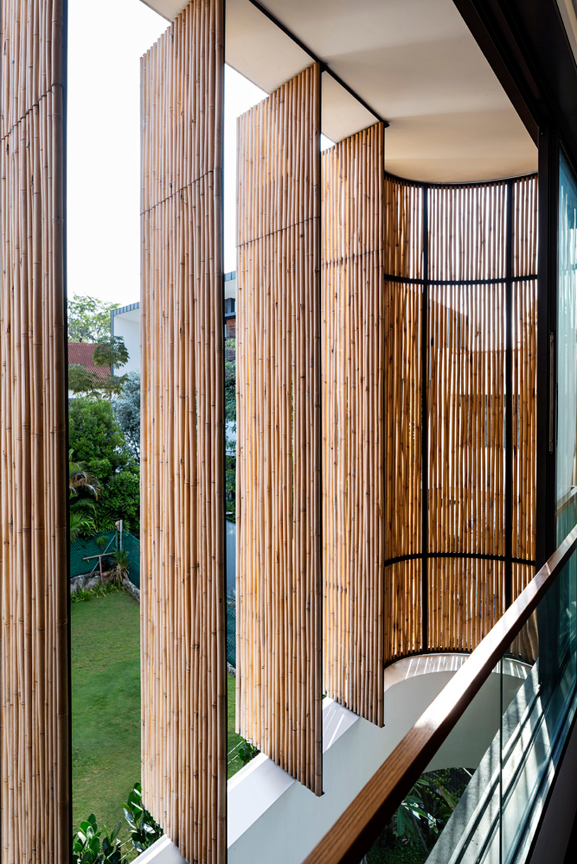 wallflower wraps house in singapore in a bamboo veil of operable screens