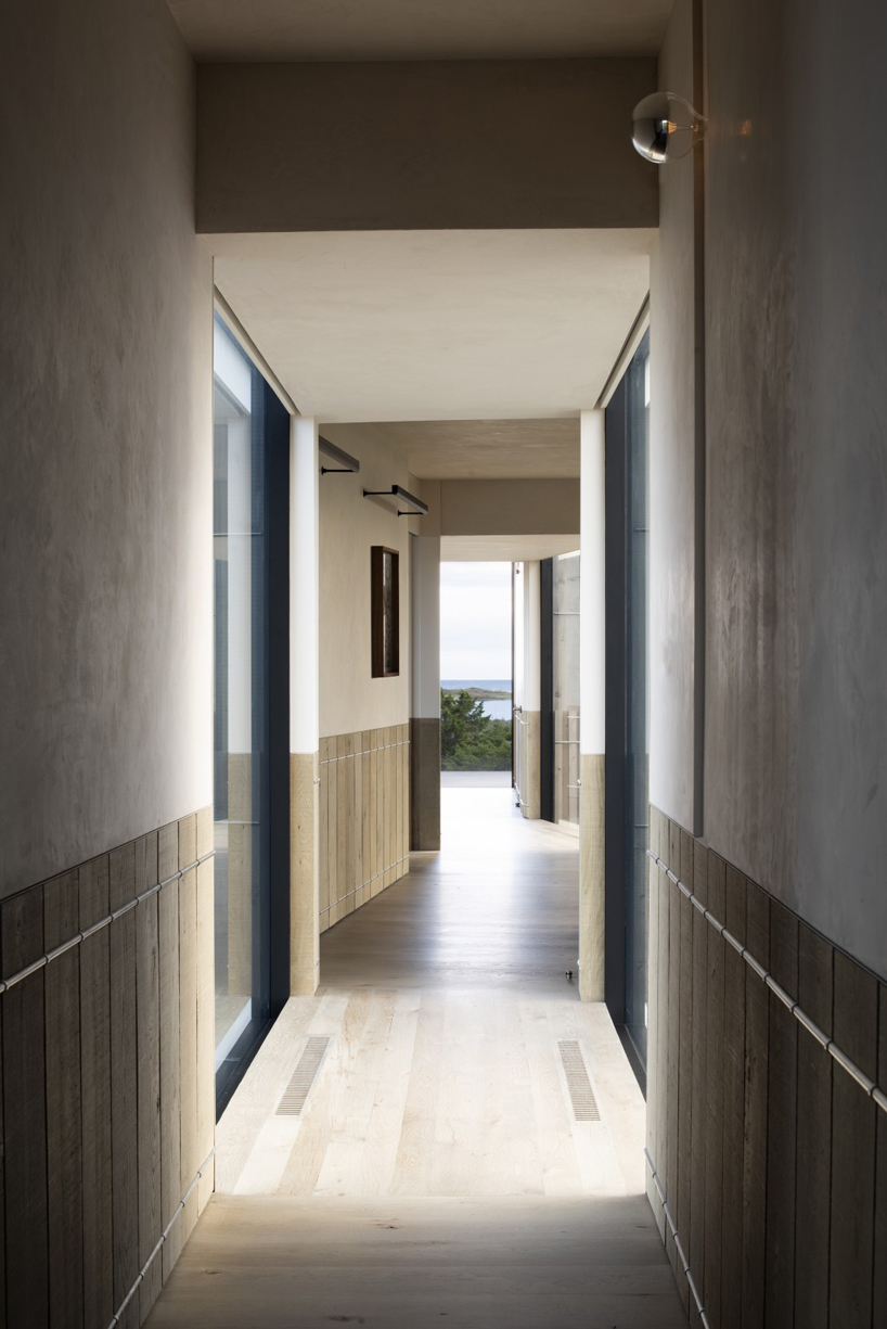bates masi + architects breaks apart and elevates long island house to embrace flooding