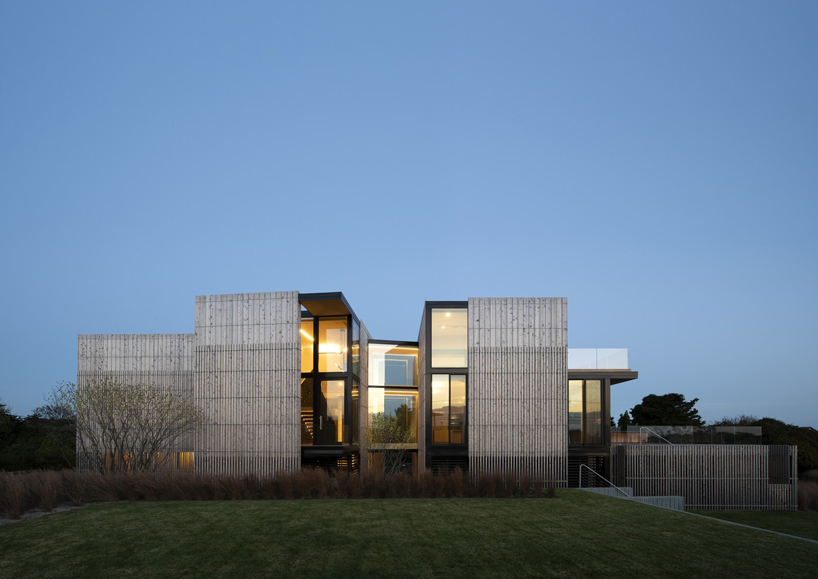 bates masi + architects breaks apart and elevates long island house to embrace flooding