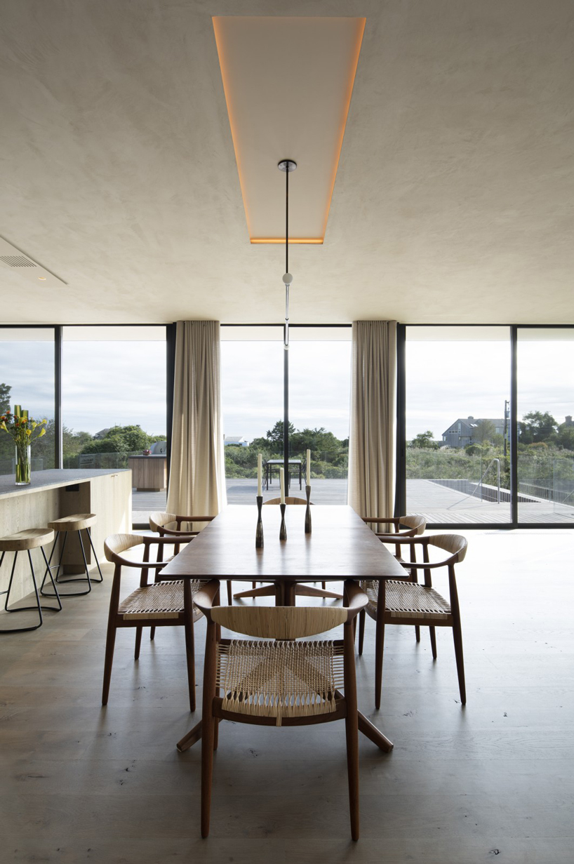 bates masi + architects breaks apart and elevates long island house to embrace flooding