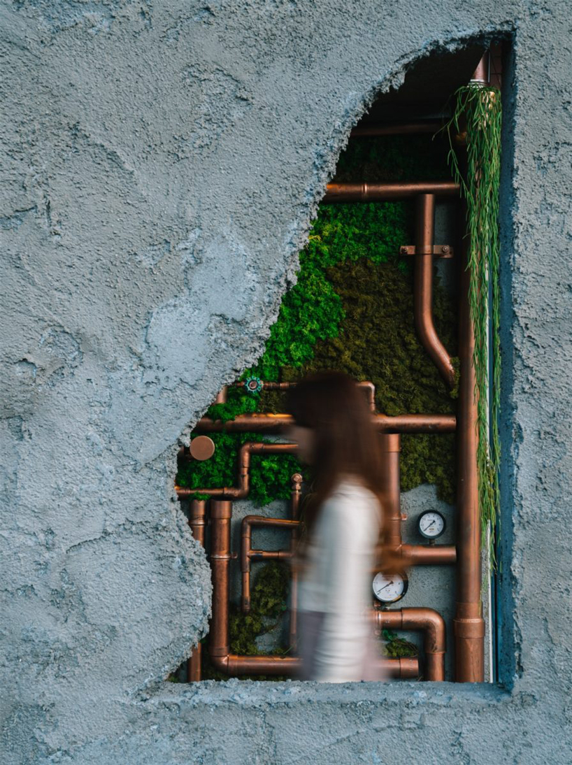 fathom finishes miyanishi yakeyama hair salon in japan with wall of greenery + copper pipes