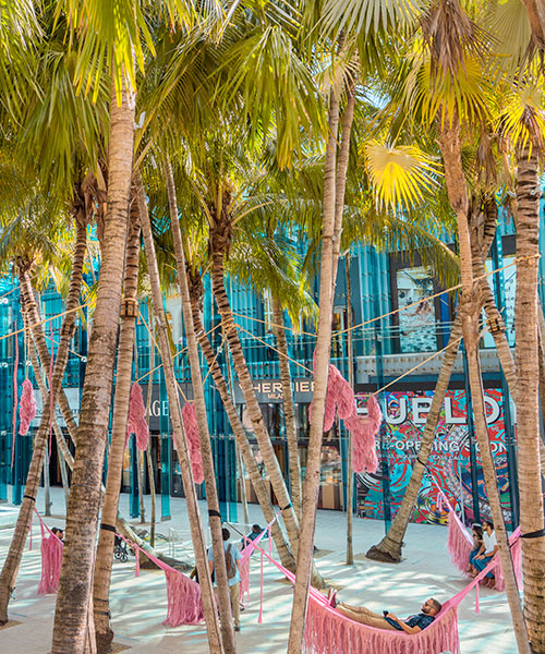 fernando laposse's naturally-dyed pink beasts hang around the miami design district