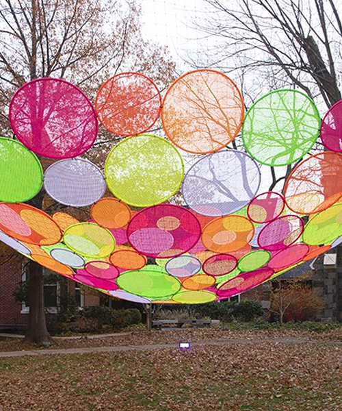 hou de sousa suspends the multi-colored 'atomic' installation in georgetown DC