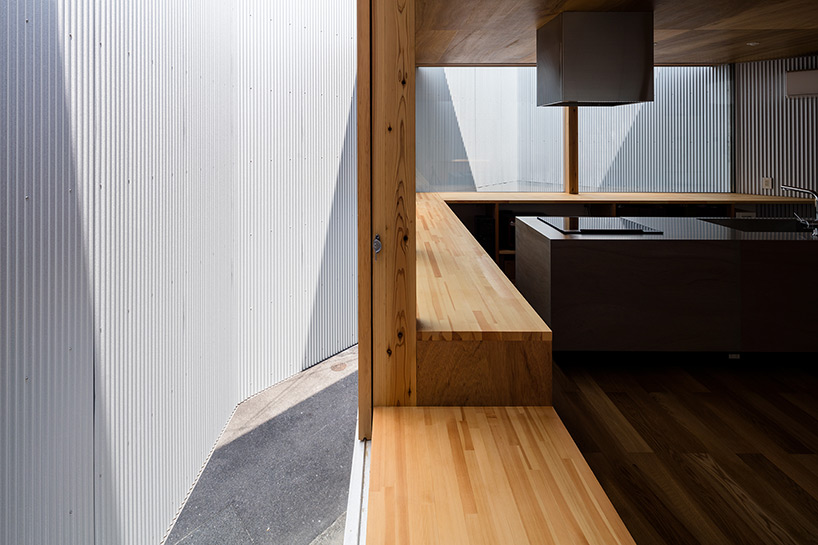 satoshi saito encloses 'house in sakai' behind tall fireproof walls