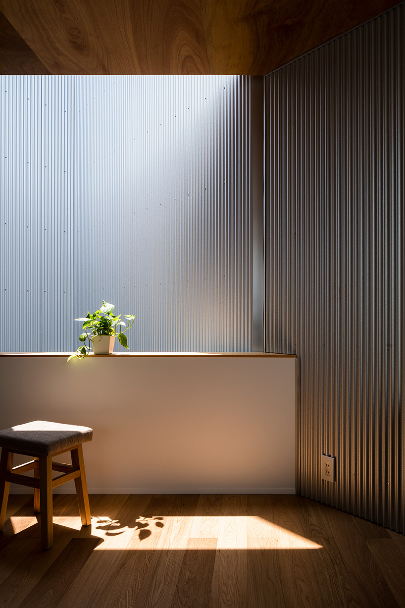 satoshi saito encloses 'house in sakai' behind tall fireproof walls