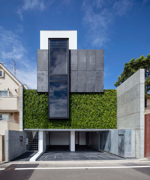 k. associates combines green wall + black steel box into the façade of house in tokyo