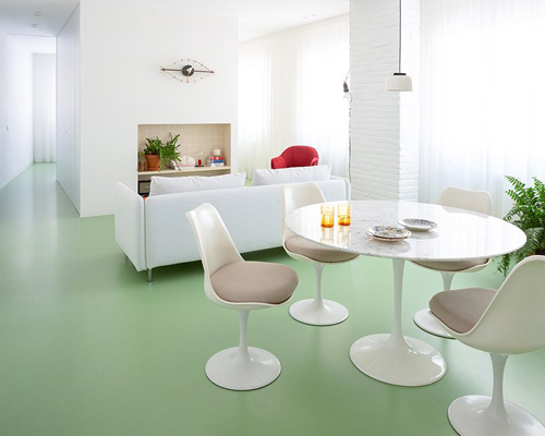 nada renovates the picasso apartment in barcelona with a continuous green floor