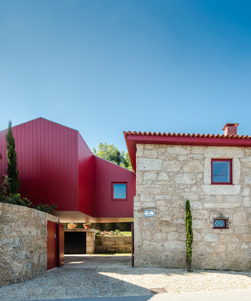 NOARQ adds suspended blood-red cabin to 'q s t' house renovation in portugal