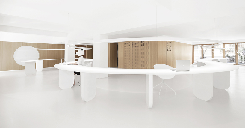 panda design builds a new office around a curved workspace in xiamen, china designboom