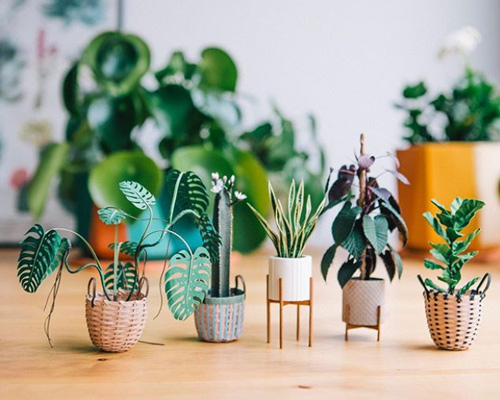 raya sader bujana intricately crafts tiny houseplants and woven baskets from paper