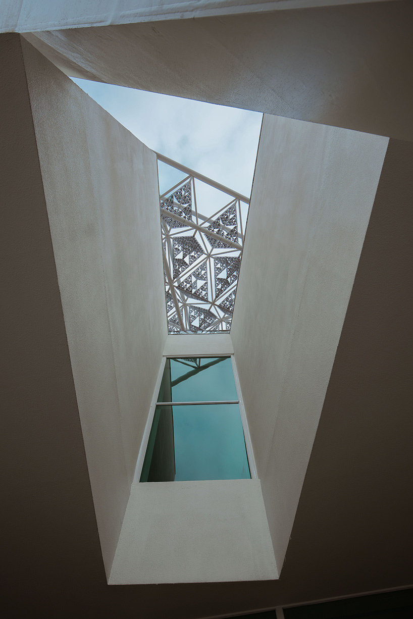 shigeru ban encloses tainan art museum beneath pentagonal roof canopy