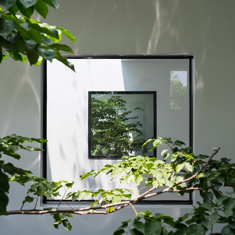 MIA design studio clads vietnamese house in façade of extruded planters + openings