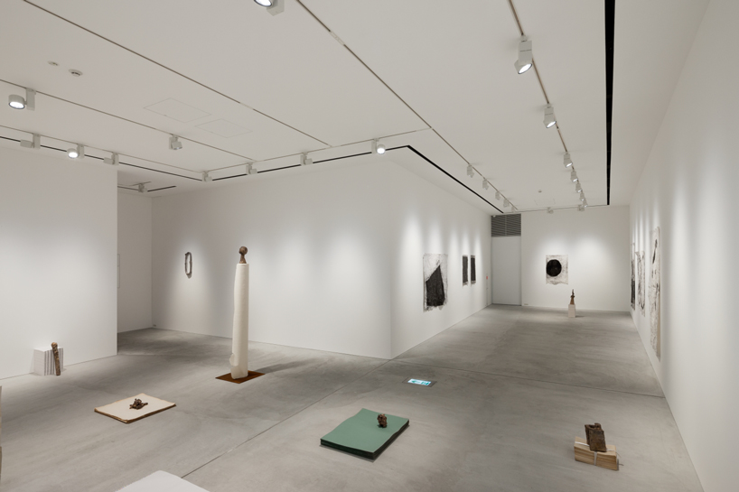 nobuo araki combines three concrete blocks into 'the mass' museum complex in tokyo