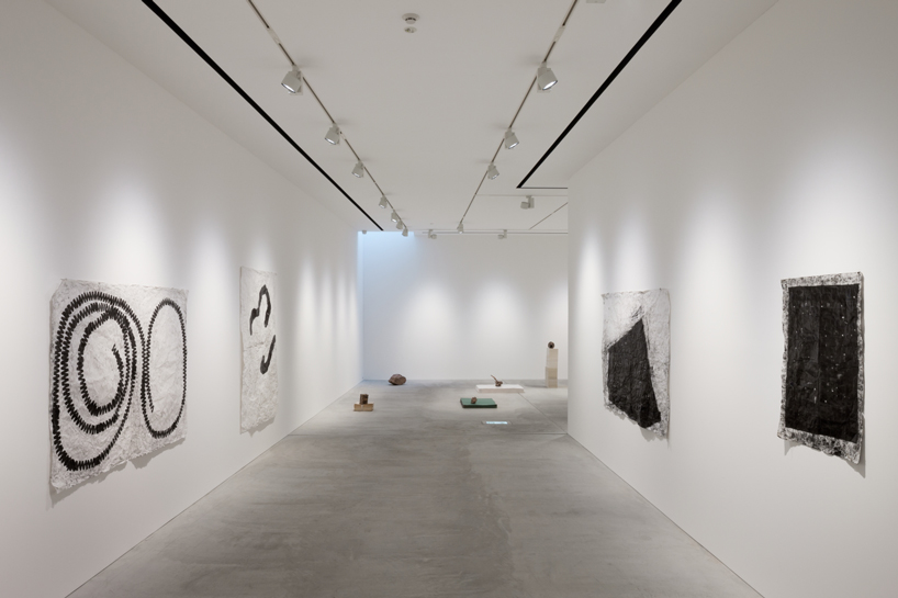 nobuo araki combines three concrete blocks into 'the mass' museum complex in tokyo