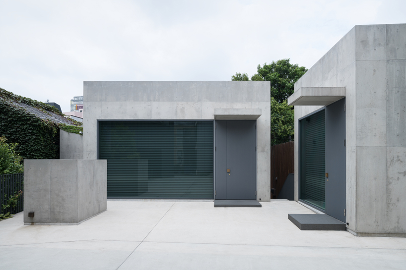 nobuo araki combines three concrete blocks into 'the mass' museum complex in tokyo